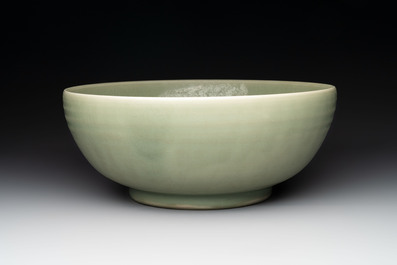 A Chinese Longquan celadon bowl with 'anhua' floral design, Ming