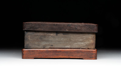 Two Chinese carved bamboo brush pots and an ink stone with wooden cover and stand, signed He Xuanting 何選廷 and Dian Liangbi 典良弼, 19th C.