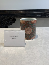 A Chinese famille verte coral-red-ground 'chrysanthemum scroll' brush pot, Kangxi