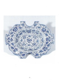 A very rare and large blue and white Dutch Delft double barber's bowl with floral design, late 17th C.