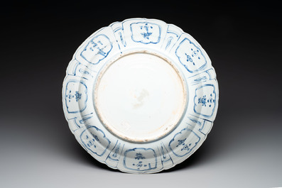 A large Chinese blue and white 'kraak' dish with birds among flowering branches, Wanli