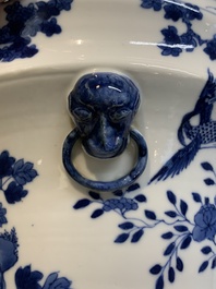 A pair of Chinese blue and white 'birds among flowering branches' jardini&egrave;res, 19th C.