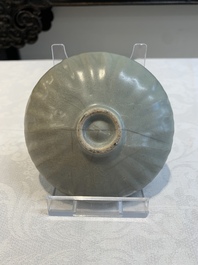 Three Chinese Longquan celadon saucers and an archaistic ge-type vase, Ming/Qing