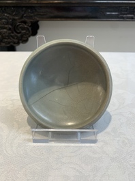 Three Chinese Longquan celadon saucers and an archaistic ge-type vase, Ming/Qing