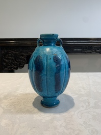 A Chinese turquoise-glazed brush rest and a Fahau vase, 18/19th C.