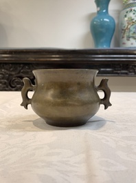 A Chinese bronze censer with Xuande mark and an archaistic vessel, 18/19th C.