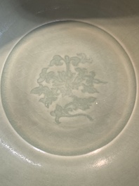 A Chinese Longquan celadon bowl with 'anhua' floral design, Ming