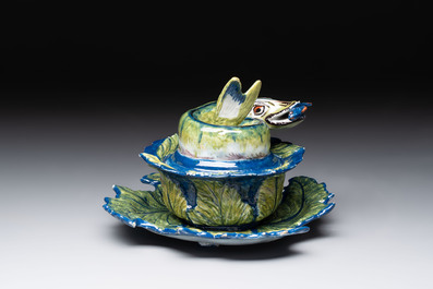 A rare polychrome Dutch Delft pike tureen and cover on stand, 18th C.