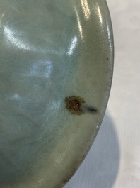 Three Chinese Longquan celadon saucers and an archaistic ge-type vase, Ming/Qing
