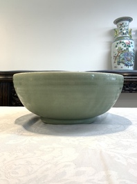 A Chinese Longquan celadon bowl with 'anhua' floral design, Ming