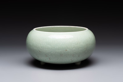 A Chinese celadon-glazed tripod censer with 'anhua' floral design, Kangxi