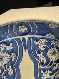 A pair of Chinese blue and white 'gu' vases with floral design, Kangxi