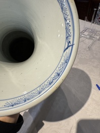 A pair of Chinese blue and white 'gu' vases with floral design, Kangxi