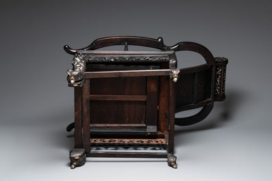 A Chinese mother-of-pearl-inlaid hongmu reclining armchair with a retractable footrest, Canton, 19th C.