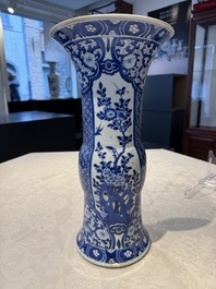 A pair of Chinese blue and white 'gu' vases with floral design, Kangxi