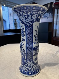 A pair of Chinese blue and white 'gu' vases with floral design, Kangxi