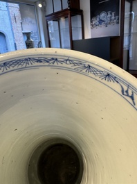 A pair of Chinese blue and white 'gu' vases with floral design, Kangxi