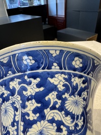 A pair of Chinese blue and white 'gu' vases with floral design, Kangxi