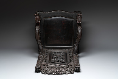 A richly carved Chinese lacquered hongmu armchair, Canton, 19th C.