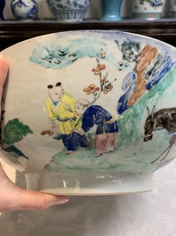 A fine Chinese famille rose bowl with figures, flowers and pheasants, Yongzheng/Qianlong