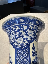 A pair of Chinese blue and white 'gu' vases with floral design, Kangxi