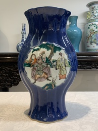 A pair of Chinese famille verte blue-ground lobed vases with figural design, 19th C.