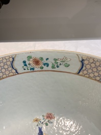 A fine Chinese famille rose bowl with figures, flowers and pheasants, Yongzheng/Qianlong