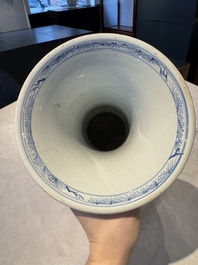 A pair of Chinese blue and white 'gu' vases with floral design, Kangxi