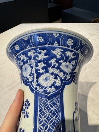 A pair of Chinese blue and white 'gu' vases with floral design, Kangxi