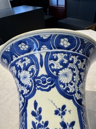 A pair of Chinese blue and white 'gu' vases with floral design, Kangxi
