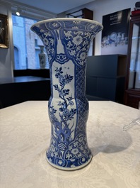 A pair of Chinese blue and white 'gu' vases with floral design, Kangxi