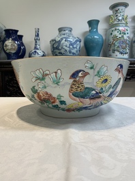 A fine Chinese famille rose bowl with figures, flowers and pheasants, Yongzheng/Qianlong