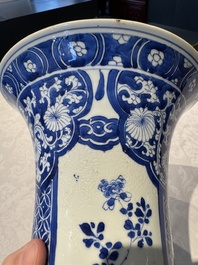 A pair of Chinese blue and white 'gu' vases with floral design, Kangxi