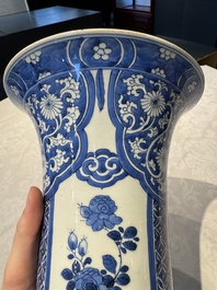 A pair of Chinese blue and white 'gu' vases with floral design, Kangxi