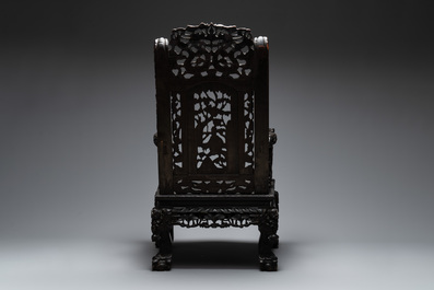 A richly carved Chinese lacquered hongmu armchair, Canton, 19th C.