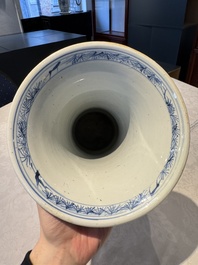 A pair of Chinese blue and white 'gu' vases with floral design, Kangxi