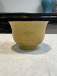 A Chinese yellow-glazed 'anhua' 'carp and lotus' bowl, Kangxi mark, 19th C.