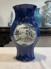 A pair of Chinese famille verte blue-ground lobed vases with figural design, 19th C.