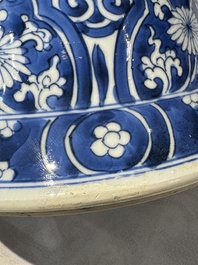 A pair of Chinese blue and white 'gu' vases with floral design, Kangxi