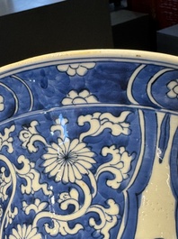 A pair of Chinese blue and white 'gu' vases with floral design, Kangxi