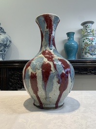 A Chinese flamb&eacute;-glazed ge-type-ground bottle vase, 19th C.