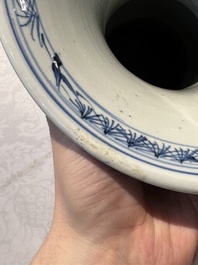 A pair of Chinese blue and white 'gu' vases with floral design, Kangxi