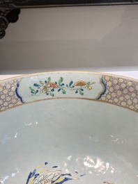 A fine Chinese famille rose bowl with figures, flowers and pheasants, Yongzheng/Qianlong