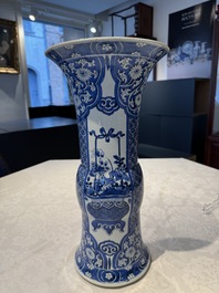 A pair of Chinese blue and white 'gu' vases with floral design, Kangxi