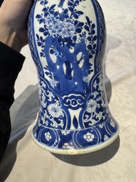A pair of Chinese blue and white 'gu' vases with floral design, Kangxi