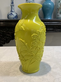 A pair of Chinese yellow Peking glass vases with peonies and a bird, 20th C.
