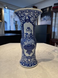A pair of Chinese blue and white 'gu' vases with floral design, Kangxi