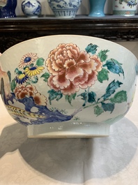 A fine Chinese famille rose bowl with figures, flowers and pheasants, Yongzheng/Qianlong