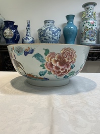 A fine Chinese famille rose bowl with figures, flowers and pheasants, Yongzheng/Qianlong