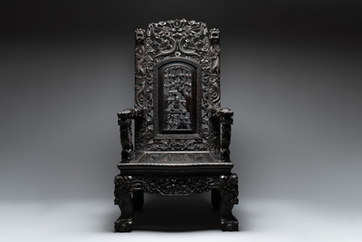 A richly carved Chinese lacquered hongmu armchair, Canton, 19th C.